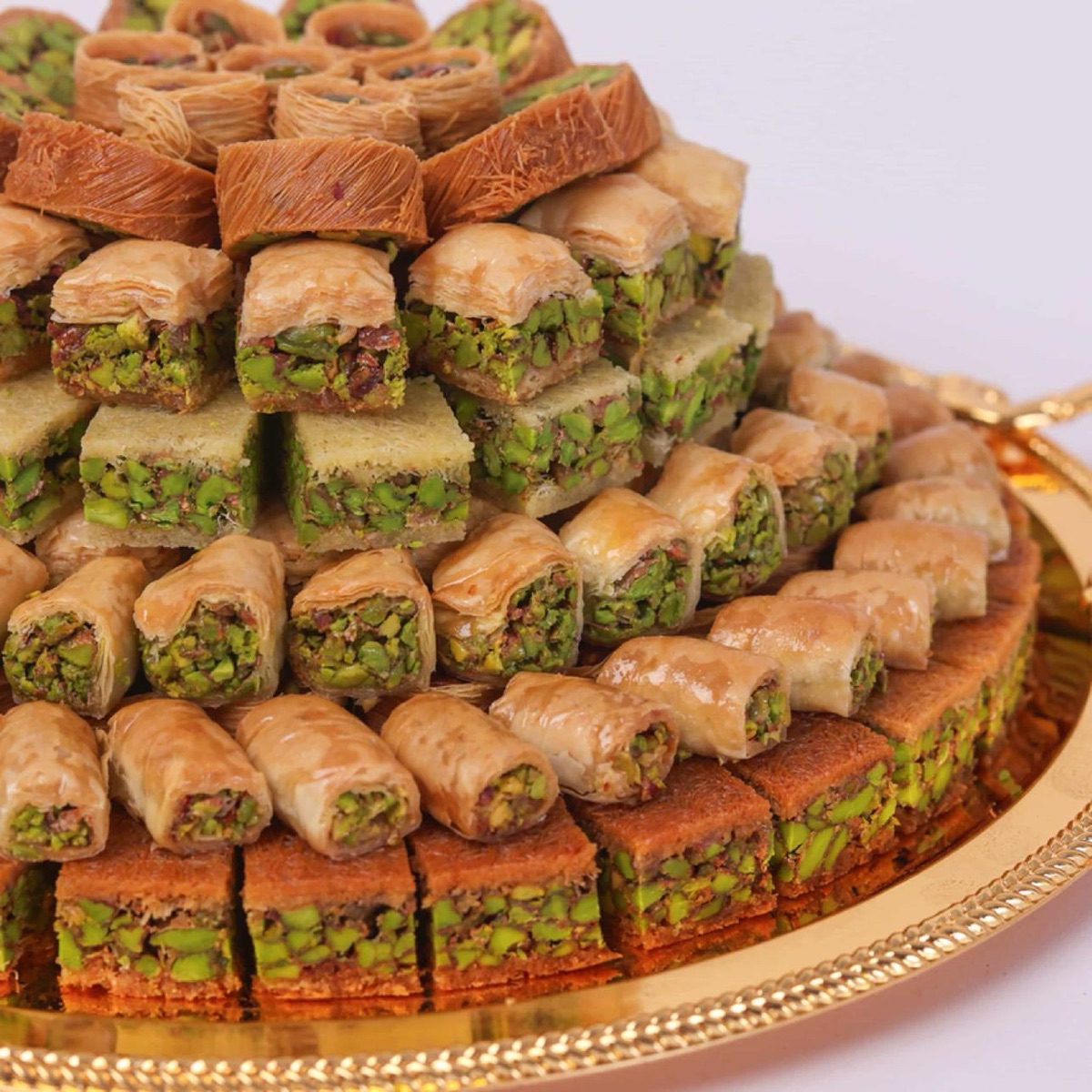 Tray of pistachio baklava and kunafa sweets